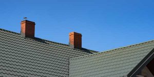 Roof with two chimneys. Chimney Waterproofing by Masonry Waterproofing, and Drainage Masters in Portland OR and Vancouver WA