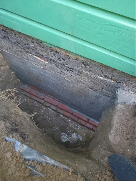 Before: basement wall of Portland OR house with deteriorating brick before parging by Masonry Masters